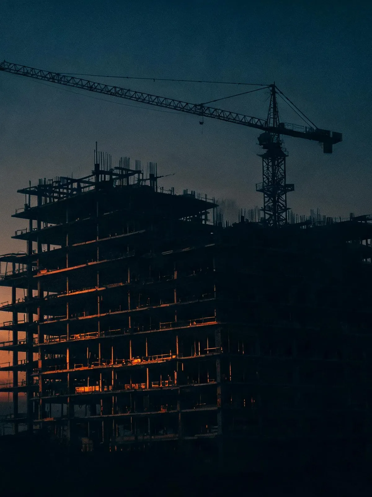 Steel frame of a building at dusk